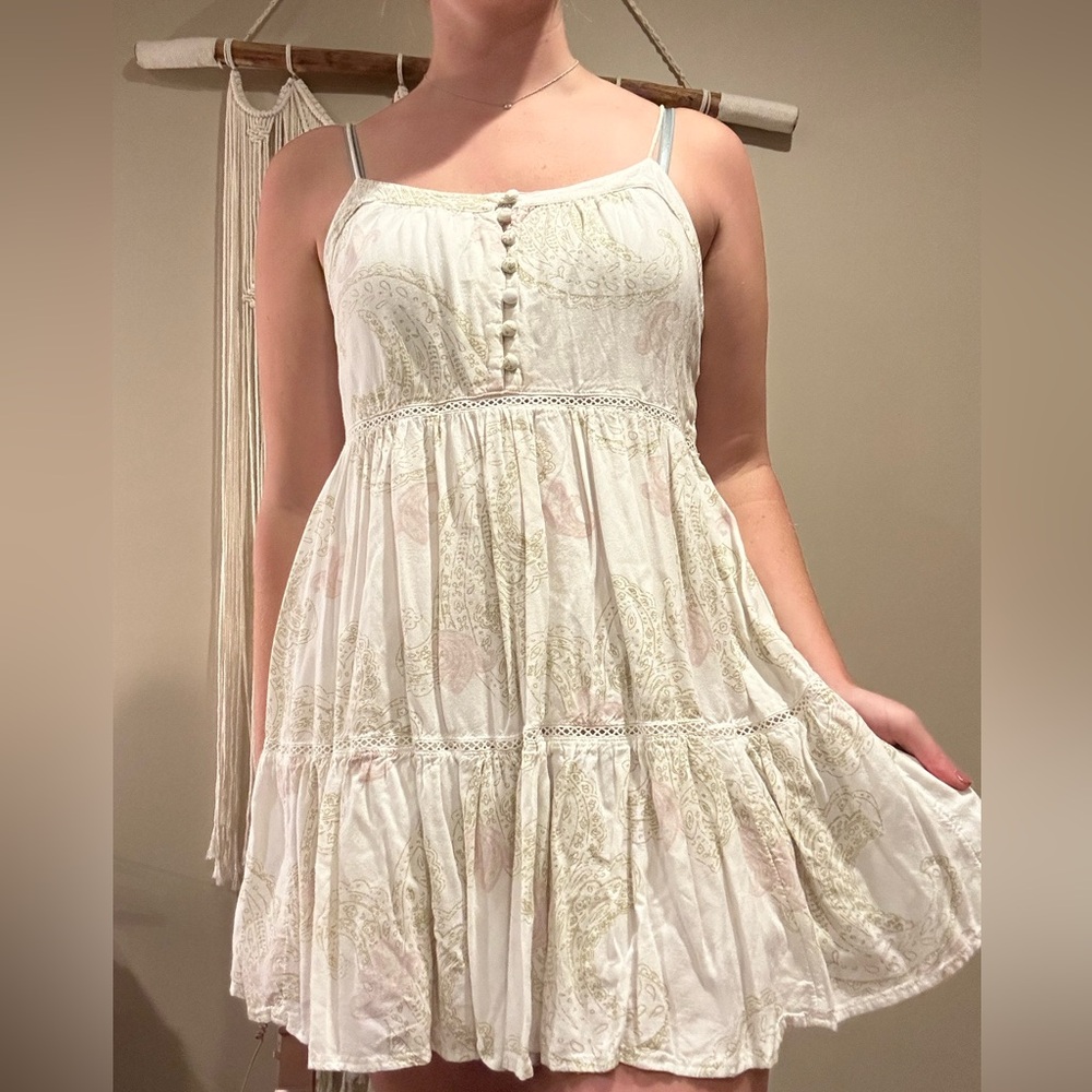 White sundress with green/pink floral pattern